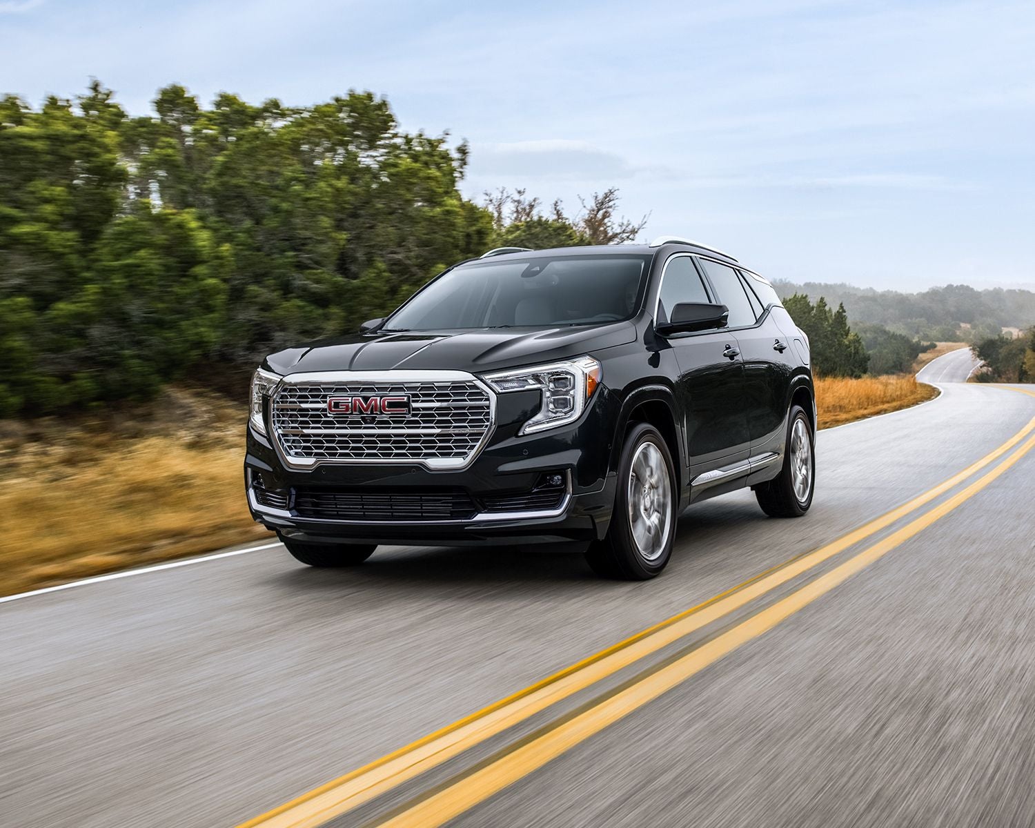 2024 GMC Terrain in motion driving down the road