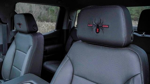 Interior view of a white GMC truck to showcase the design of the seats